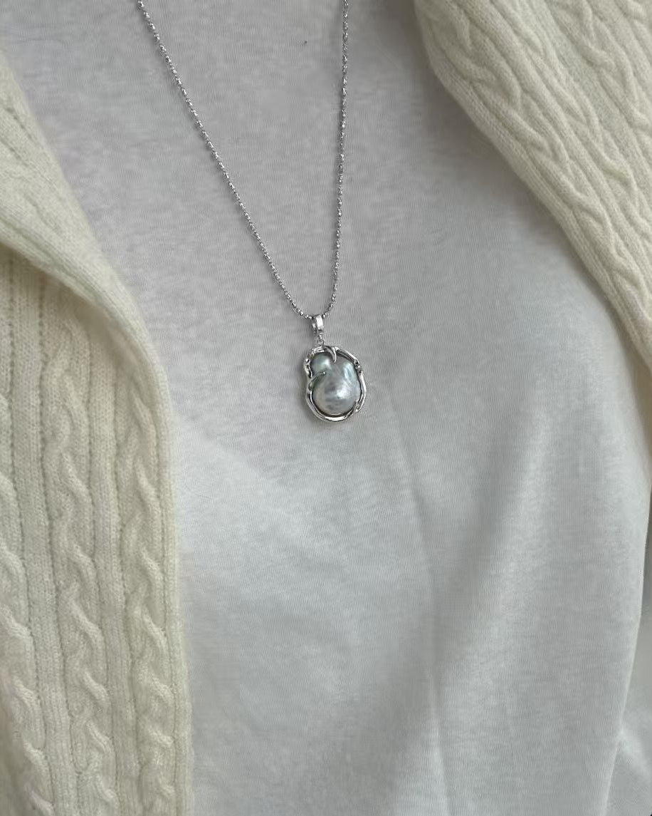 Pearl necklace on a plain background