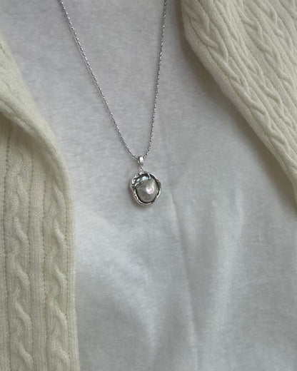 Necklace with a pendant on a light gray background