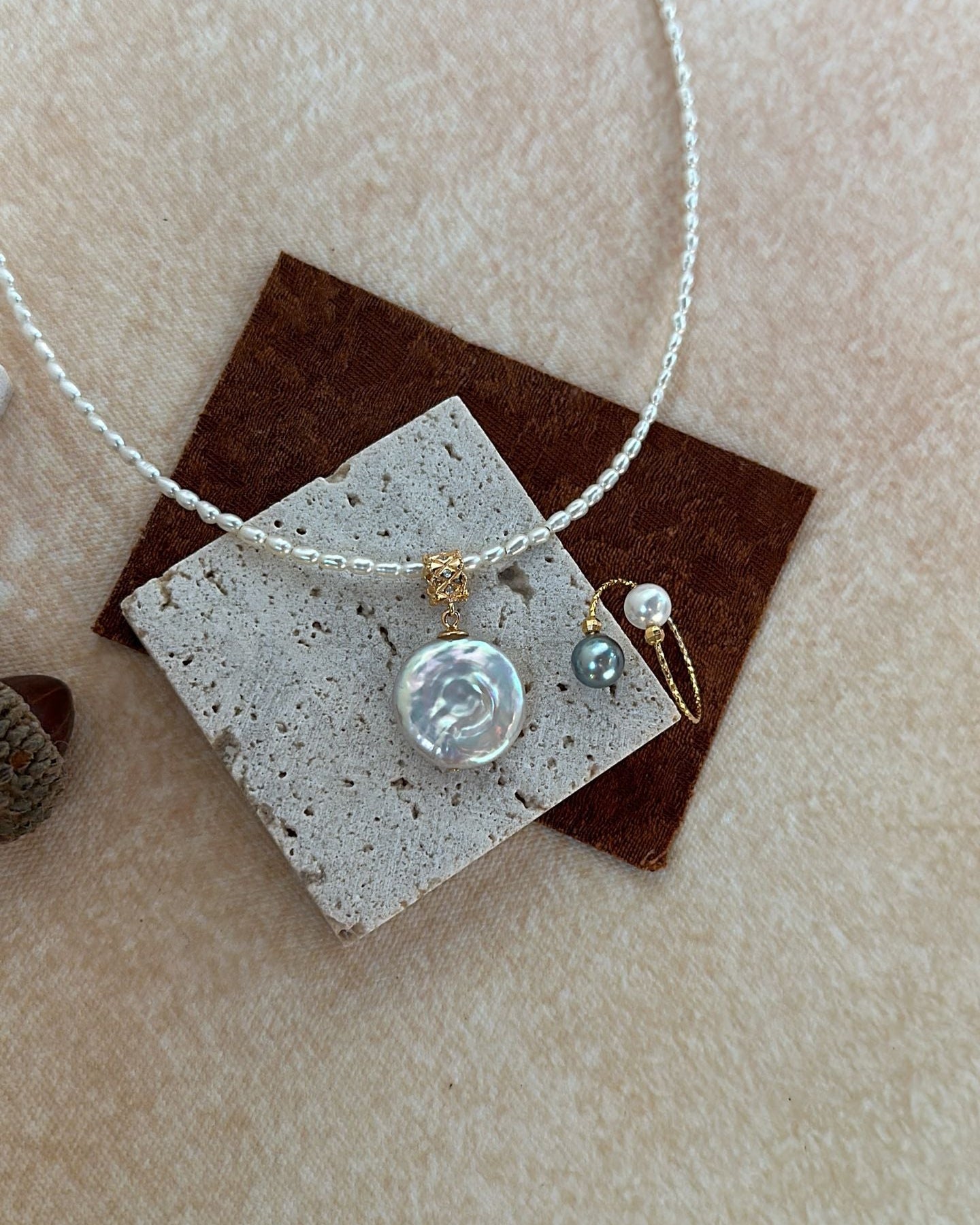 Necklace with a pendant on a textured surface